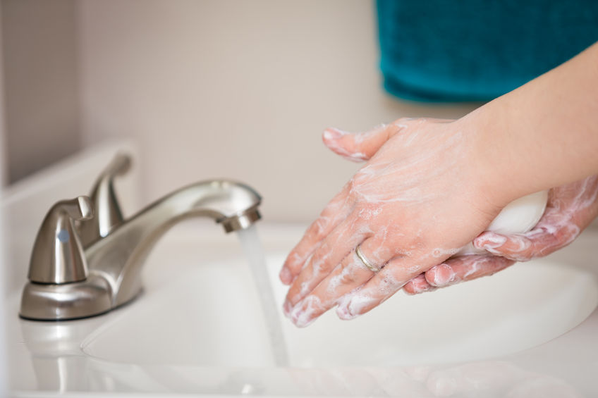 Image of person washing hands