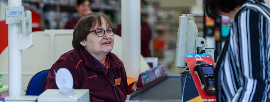 Cashier and female customer in conversation