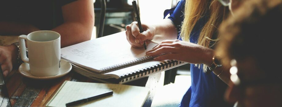 People talking at a desk