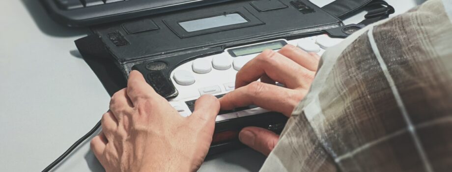 person holding black plastic case